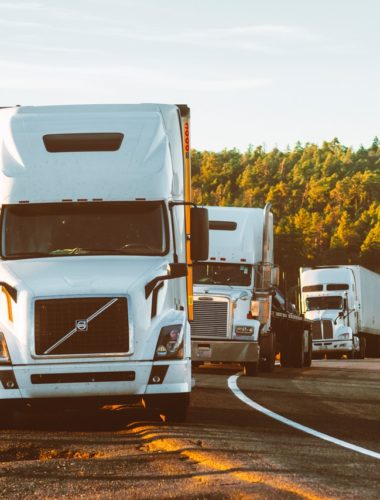 white-volvo-semi-truck-on-side-of-road-2199293